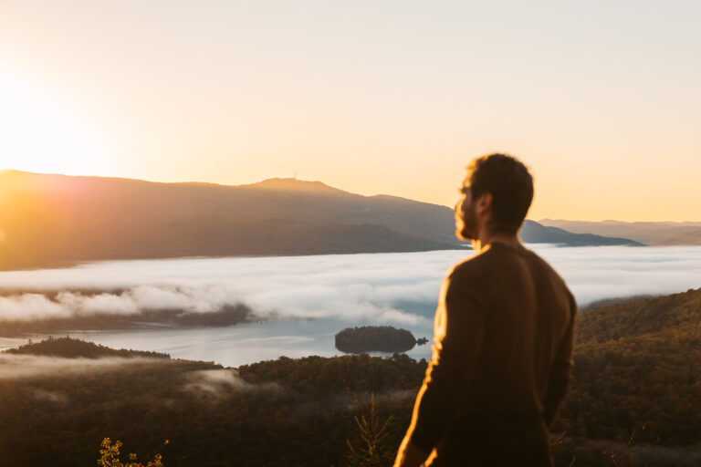man looking at fall inversion at sunrise